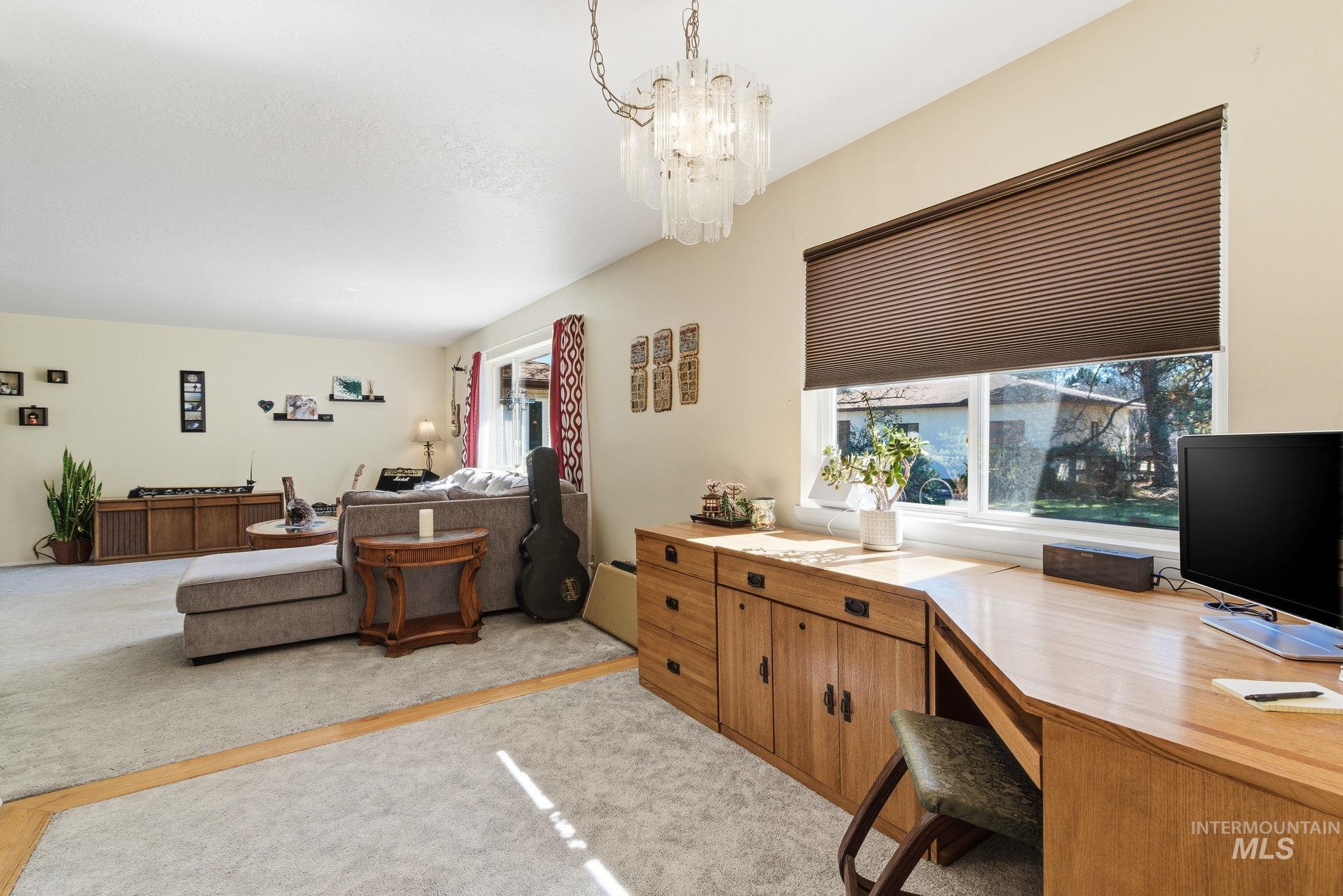 12055 West McMillan Road Boise, ID 83713 - Photo 13 of 42 Office space with light carpet and hanging lights