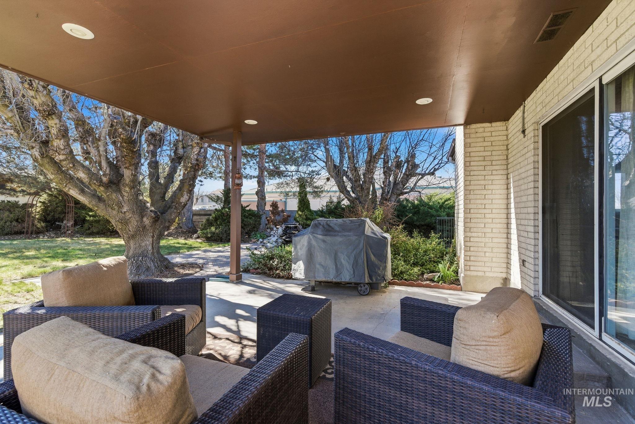 12055 West McMillan Road Boise, ID 83713 - Photo 23 of 42 View of patio / terrace with grilling area and an outdoor lounge area