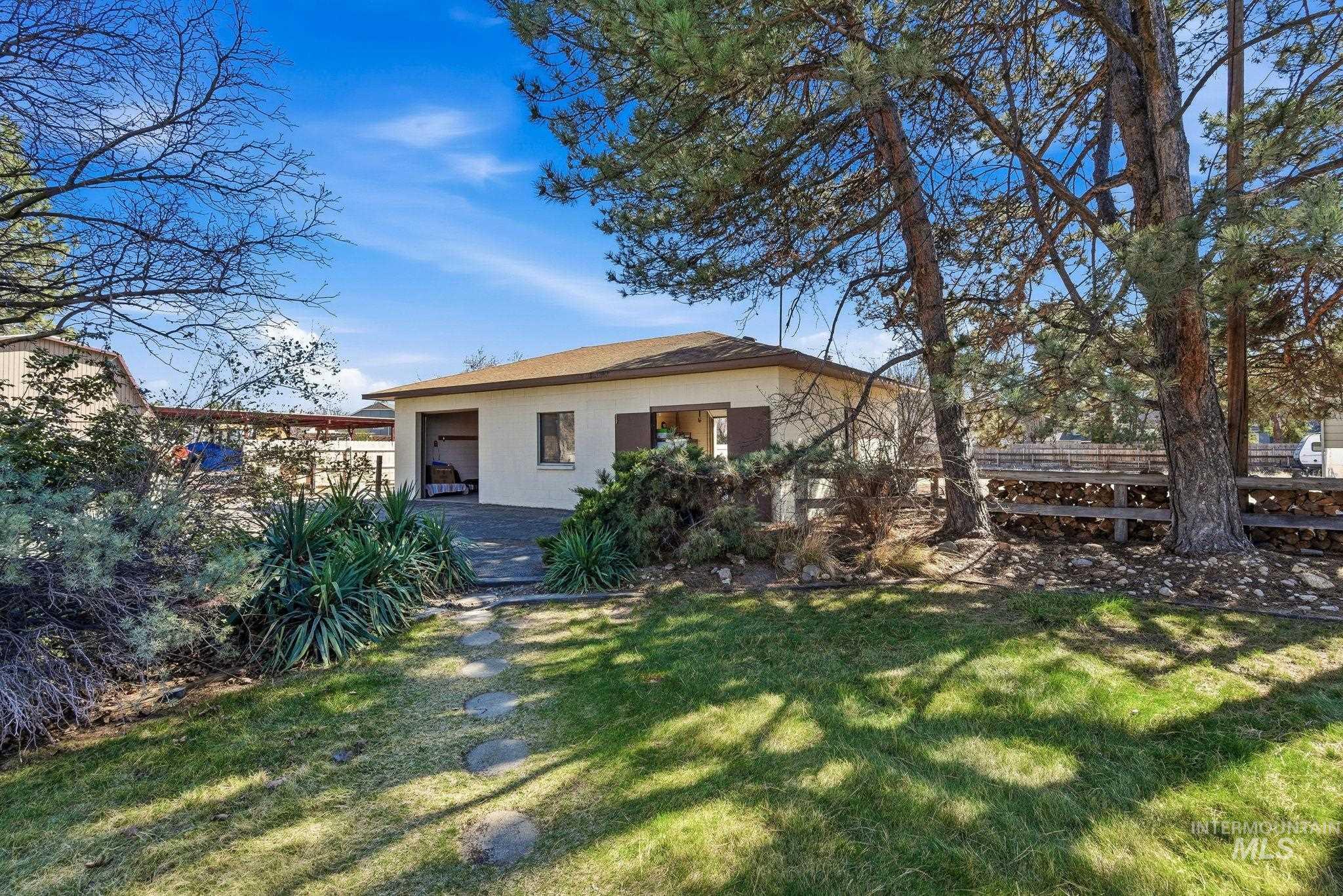12055 West McMillan Road Boise, ID 83713 - Photo 25 of 42 Back of house featuring a patio