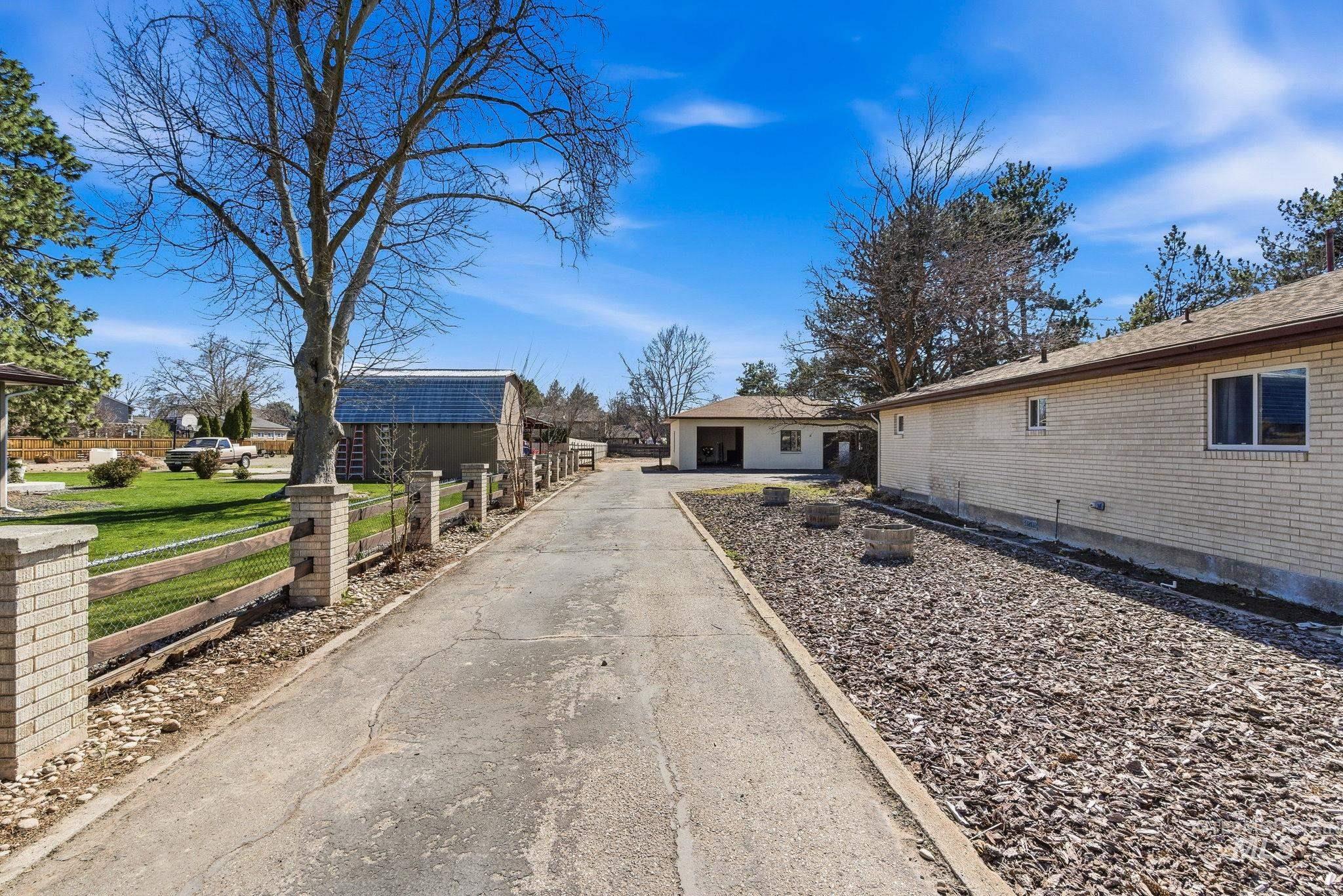 12055 West McMillan Road Boise, ID 83713 - Photo 29 of 42 View of side of home featuring an outdoor structure