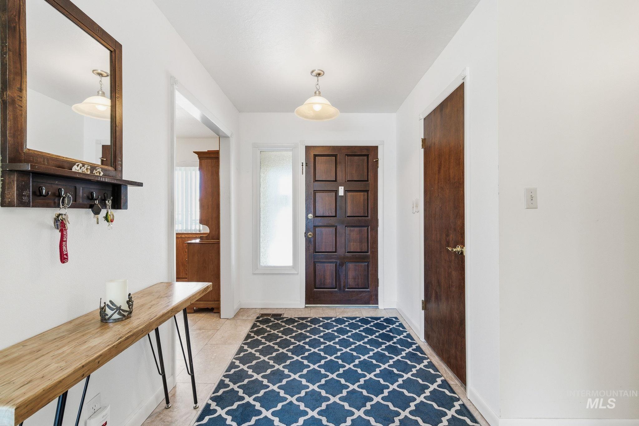 12055 West McMillan Road Boise, ID 83713 - Photo 3 of 42 Entrance foyer featuring baseboards