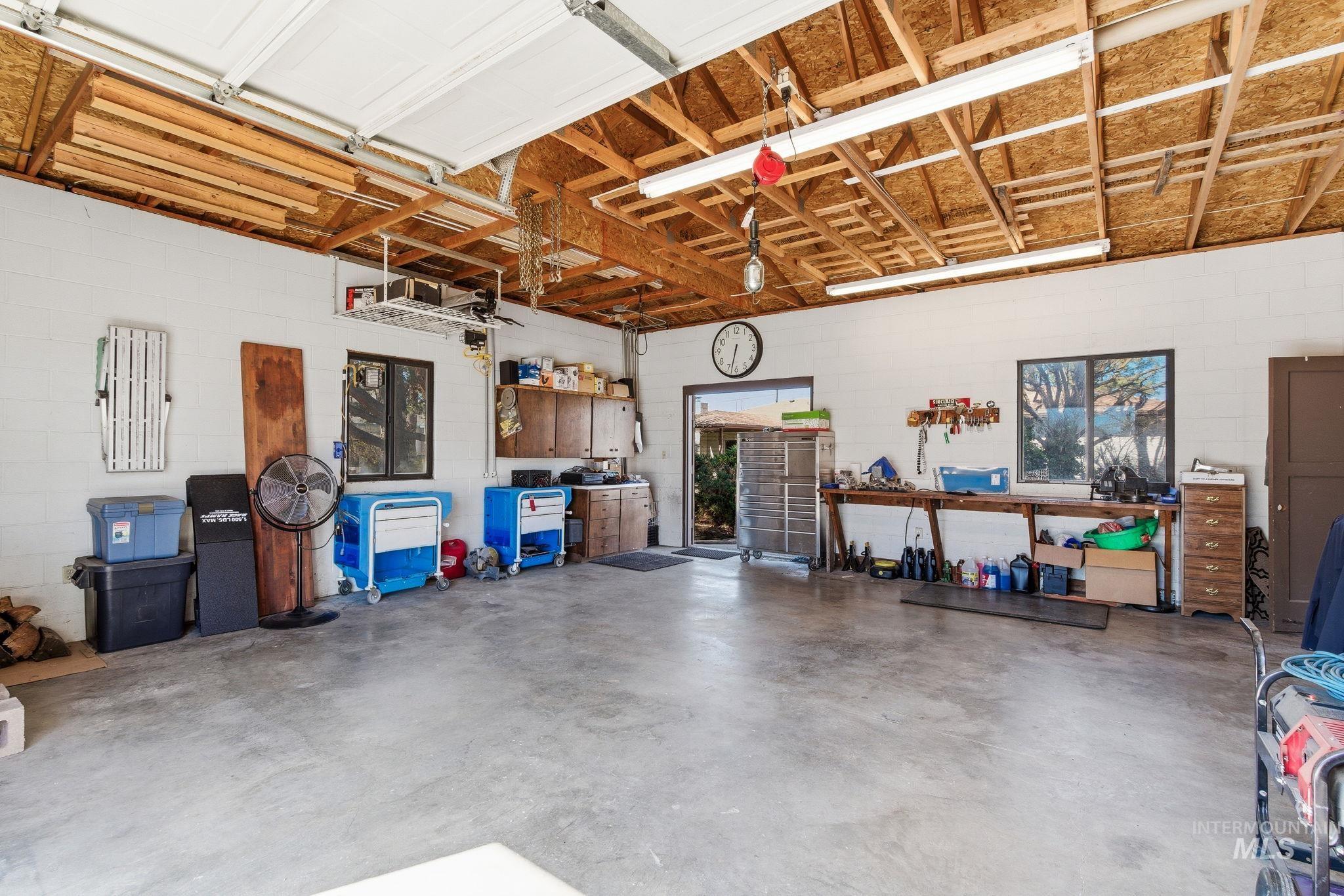 12055 West McMillan Road Boise, ID 83713 - Photo 37 of 42 Garage featuring concrete block wall