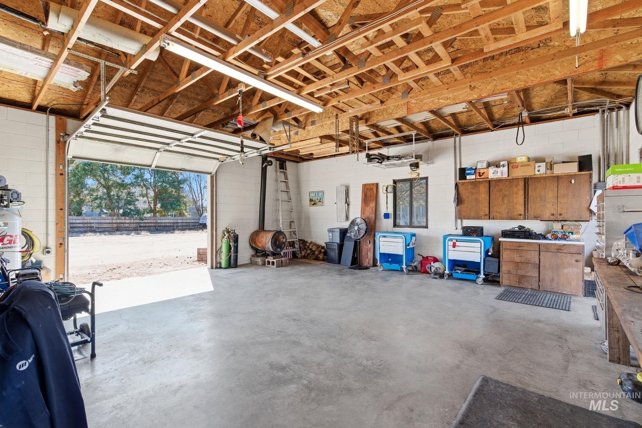 12055 West McMillan Road Boise, ID 83713 - Photo 39 of 42 Garage featuring concrete block wall
