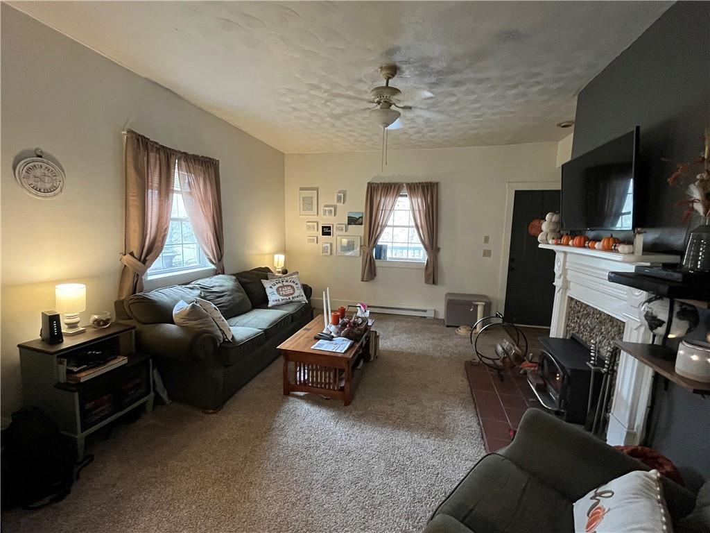 197 Oak Road Holbrook, PA 15341 - Photo 11 of 17 a living room with furniture a ceiling fan and a window