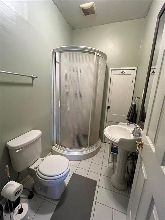197 Oak Road Holbrook, PA 15341 - Photo 13 of 17 a white toilet sitting next to a bathroom sink