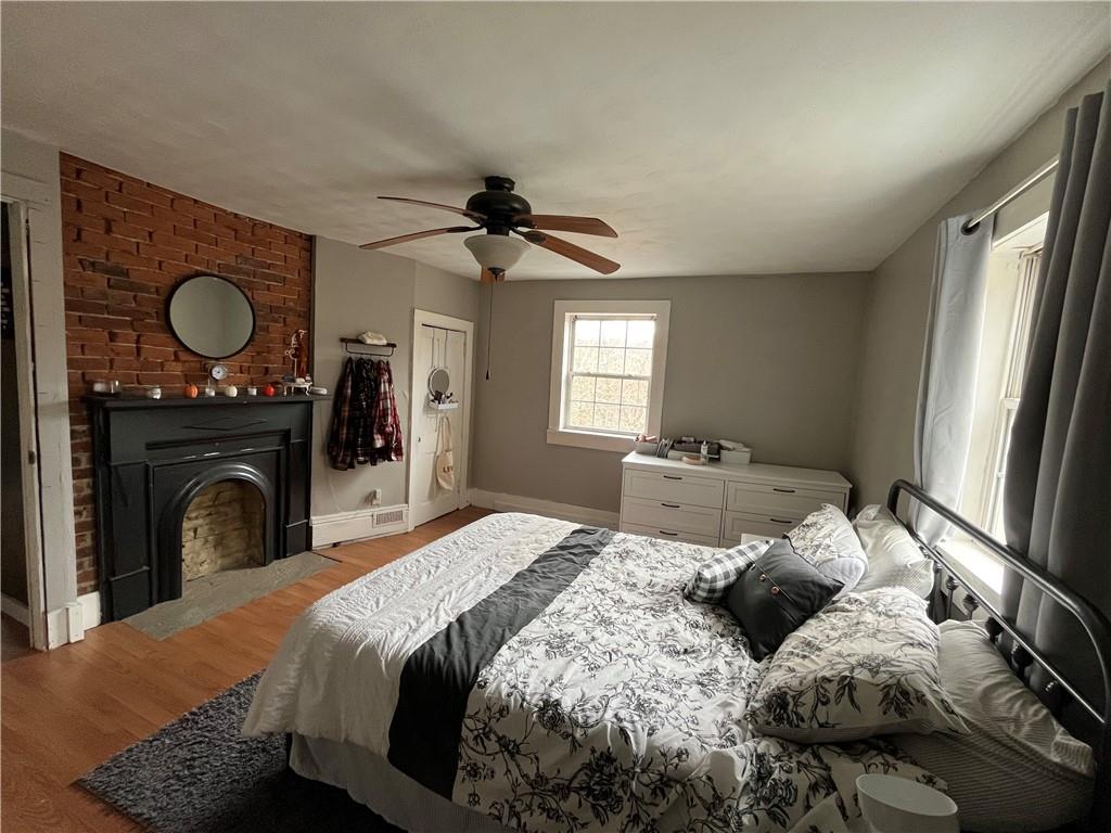 197 Oak Road Holbrook, PA 15341 - Photo 15 of 17 a bedroom with a large bed and a window