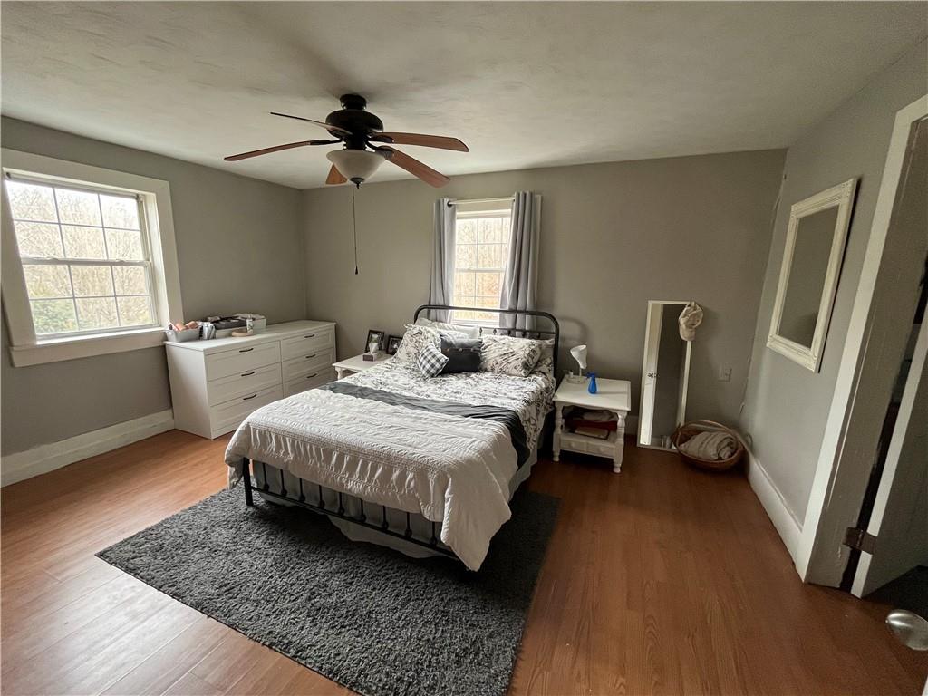 197 Oak Road Holbrook, PA 15341 - Photo 16 of 17 a bedroom with a bed and a chandelier