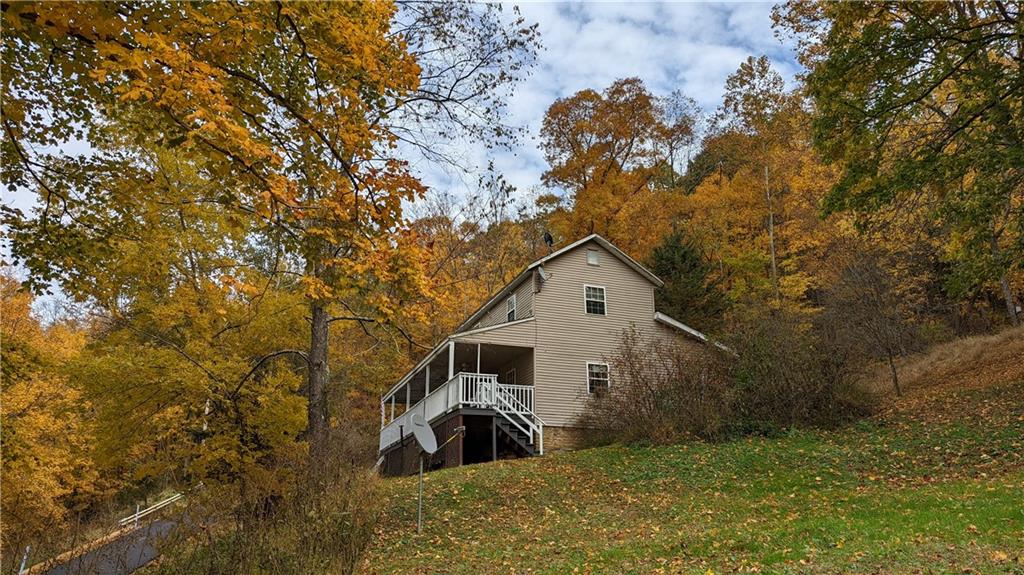 197 Oak Road Holbrook, PA 15341 - Photo 3 of 17 a view of a house with a tree in the background