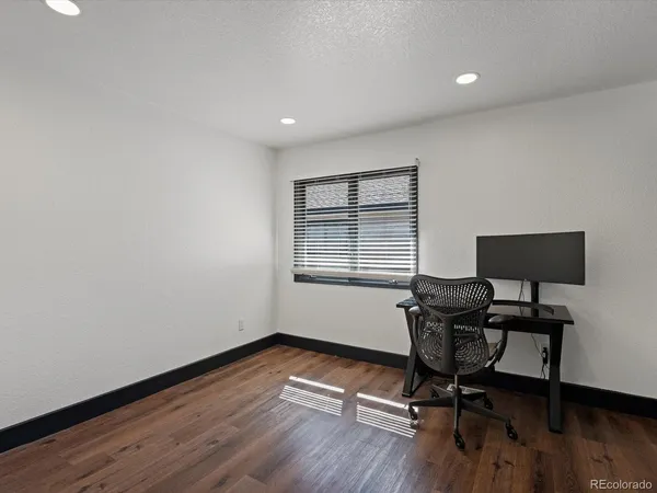 a workspace with furniture and a window