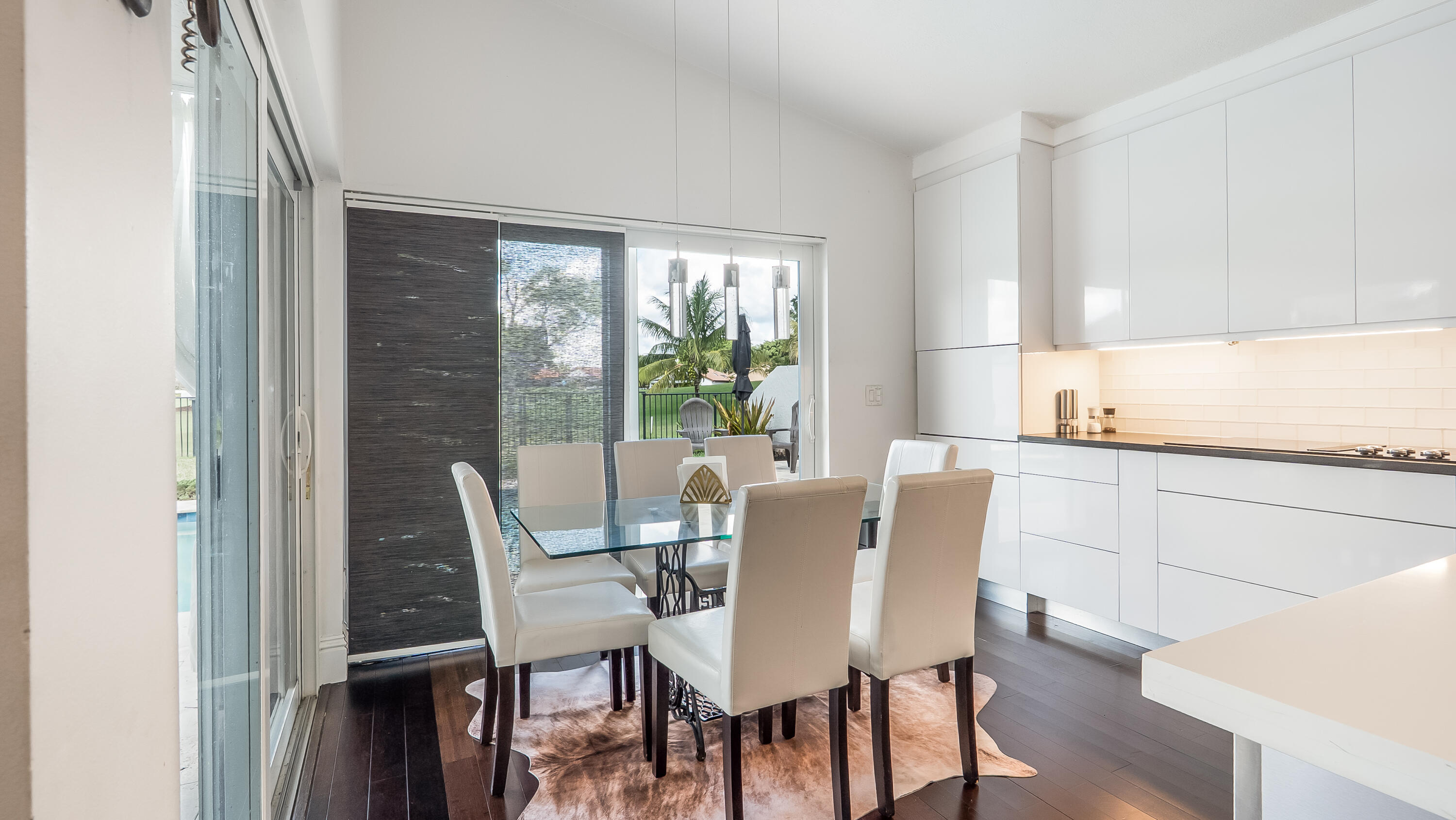 10208 Sunset Bend Drive Boca Raton, FL 33428 - Photo 11 of 40 a view of a dining room with furniture and wooden floor