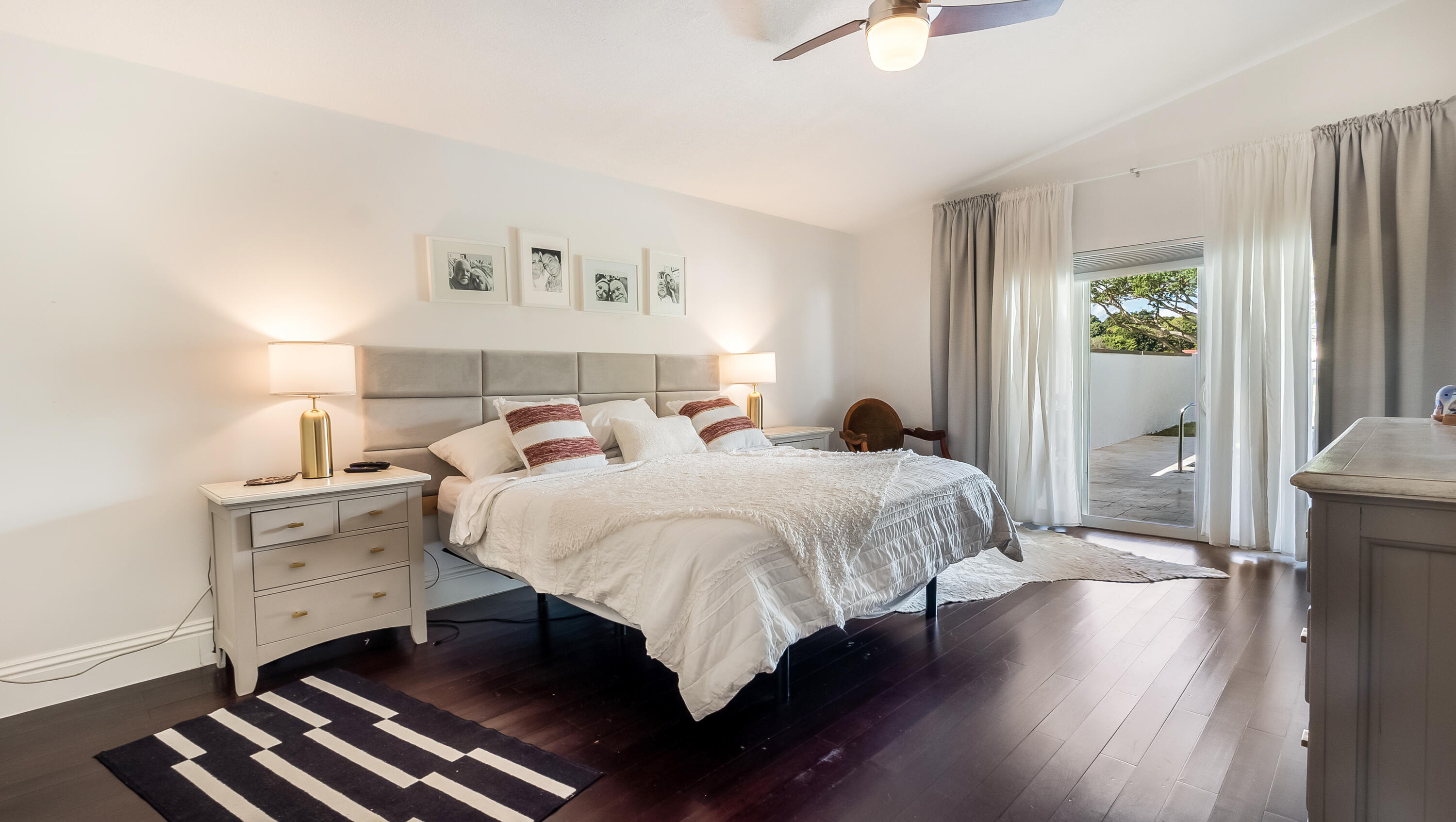 10208 Sunset Bend Drive Boca Raton, FL 33428 - Photo 15 of 40 a bedroom with a bed and a chandelier