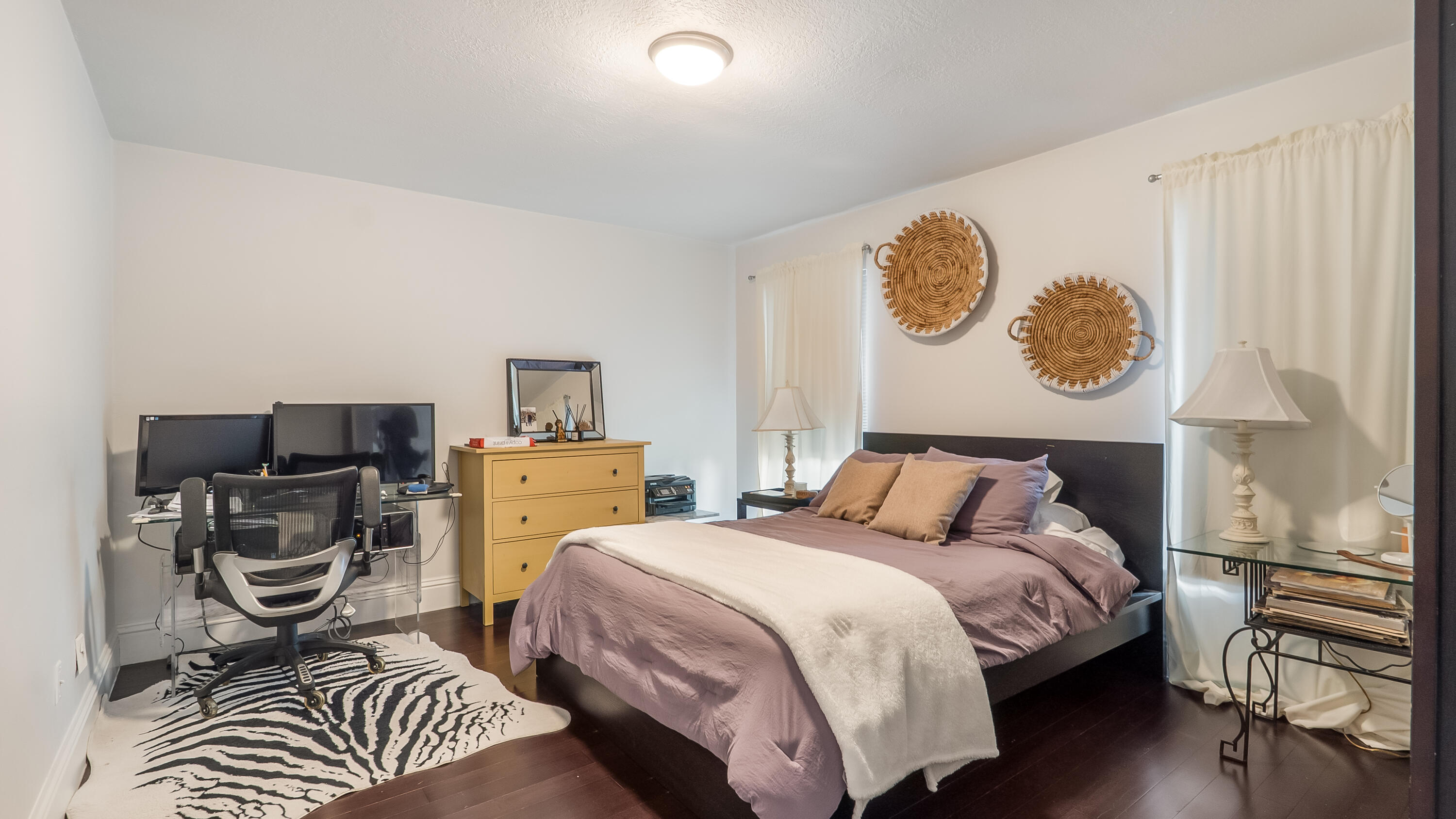 10208 Sunset Bend Drive Boca Raton, FL 33428 - Photo 22 of 40 a bedroom with a bed and a table in it with chair