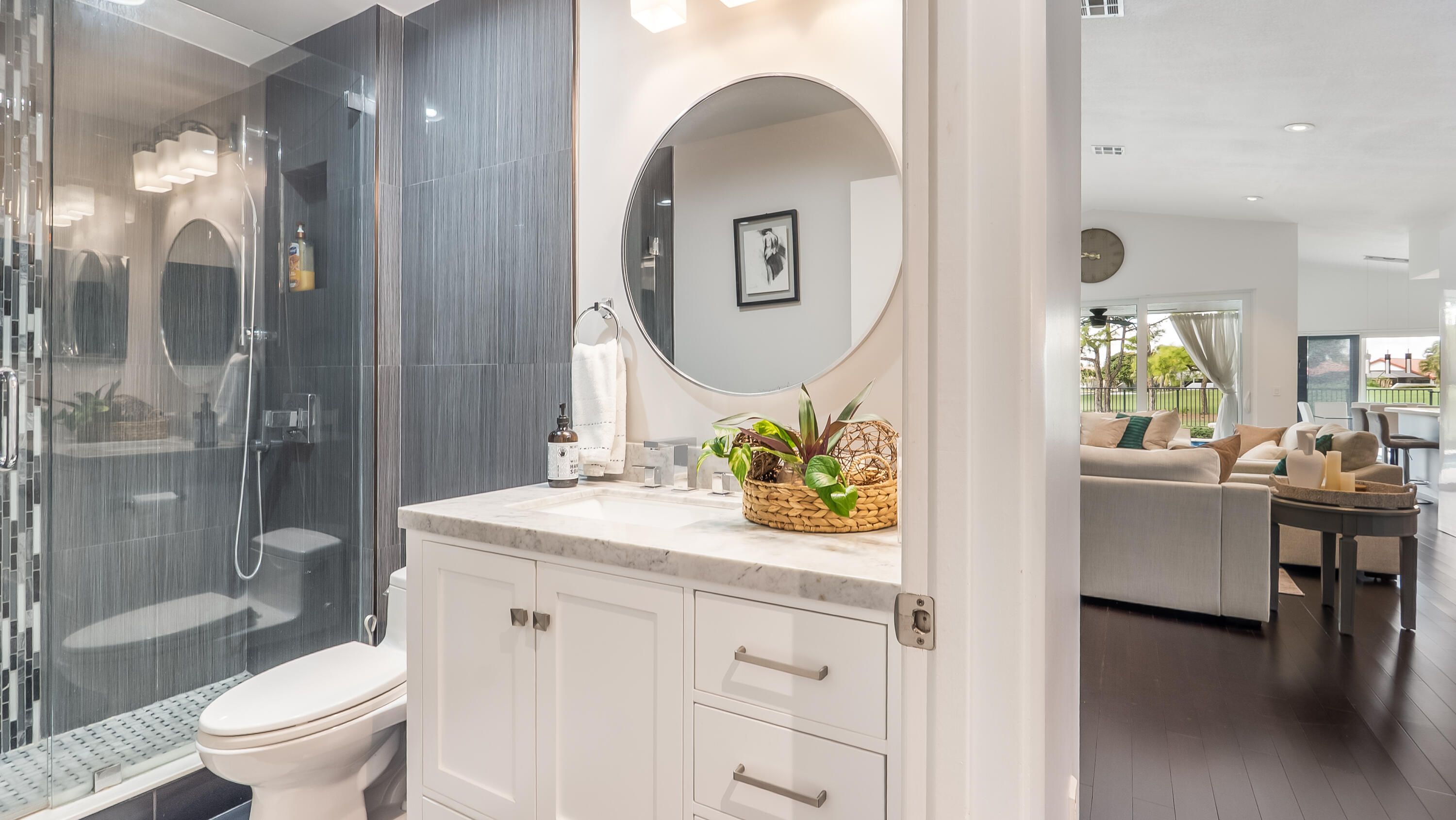 10208 Sunset Bend Drive Boca Raton, FL 33428 - Photo 24 of 40 a bathroom with a granite countertop sink a toilet and a mirror