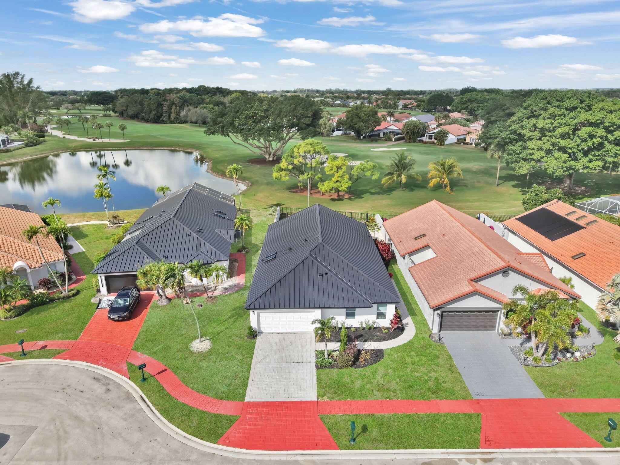 10208 Sunset Bend Drive Boca Raton, FL 33428 - Photo 29 of 40 an aerial view of residential houses with outdoor space and river
