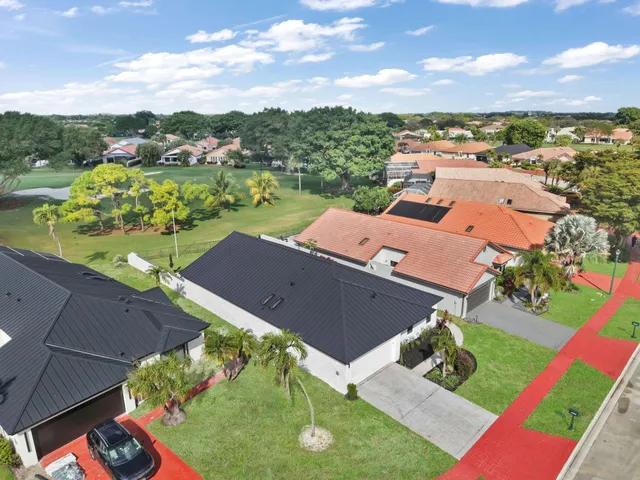 an aerial view of a house with a garden