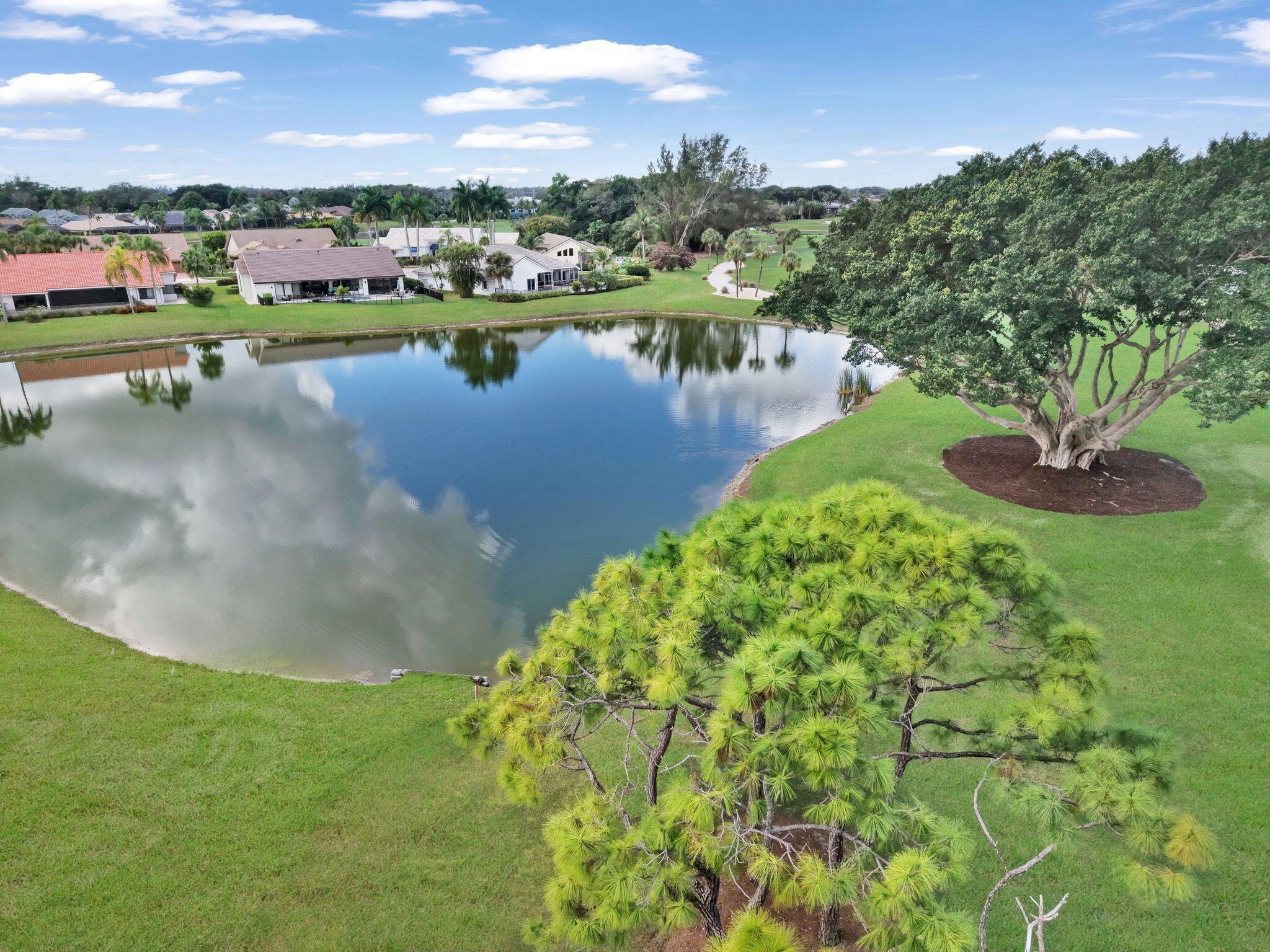 10208 Sunset Bend Drive Boca Raton, FL 33428 - Photo 32 of 40 a view of a lake with houses