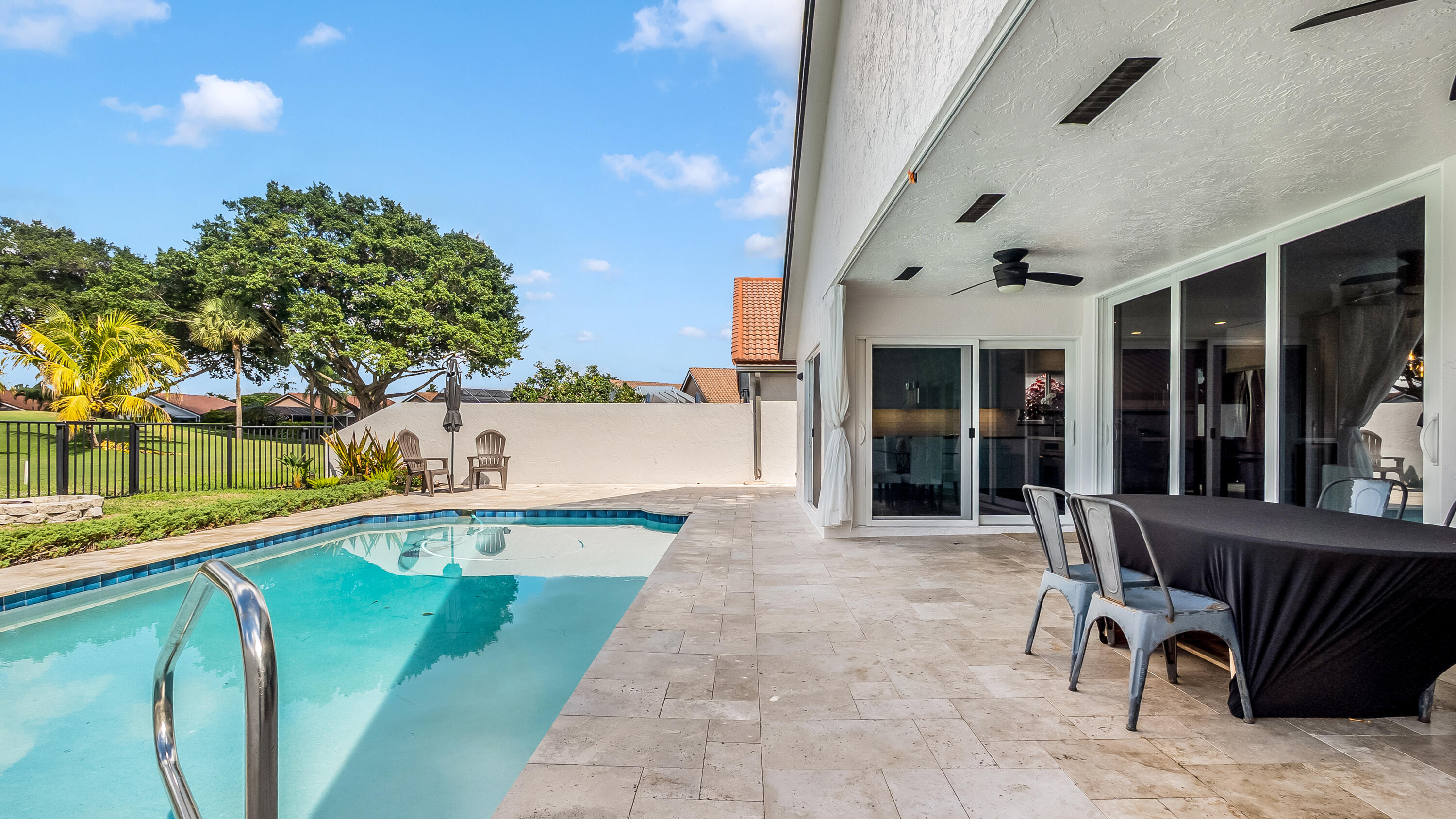 10208 Sunset Bend Drive Boca Raton, FL 33428 - Photo 38 of 40 a view of a patio with table and chairs and potted plants