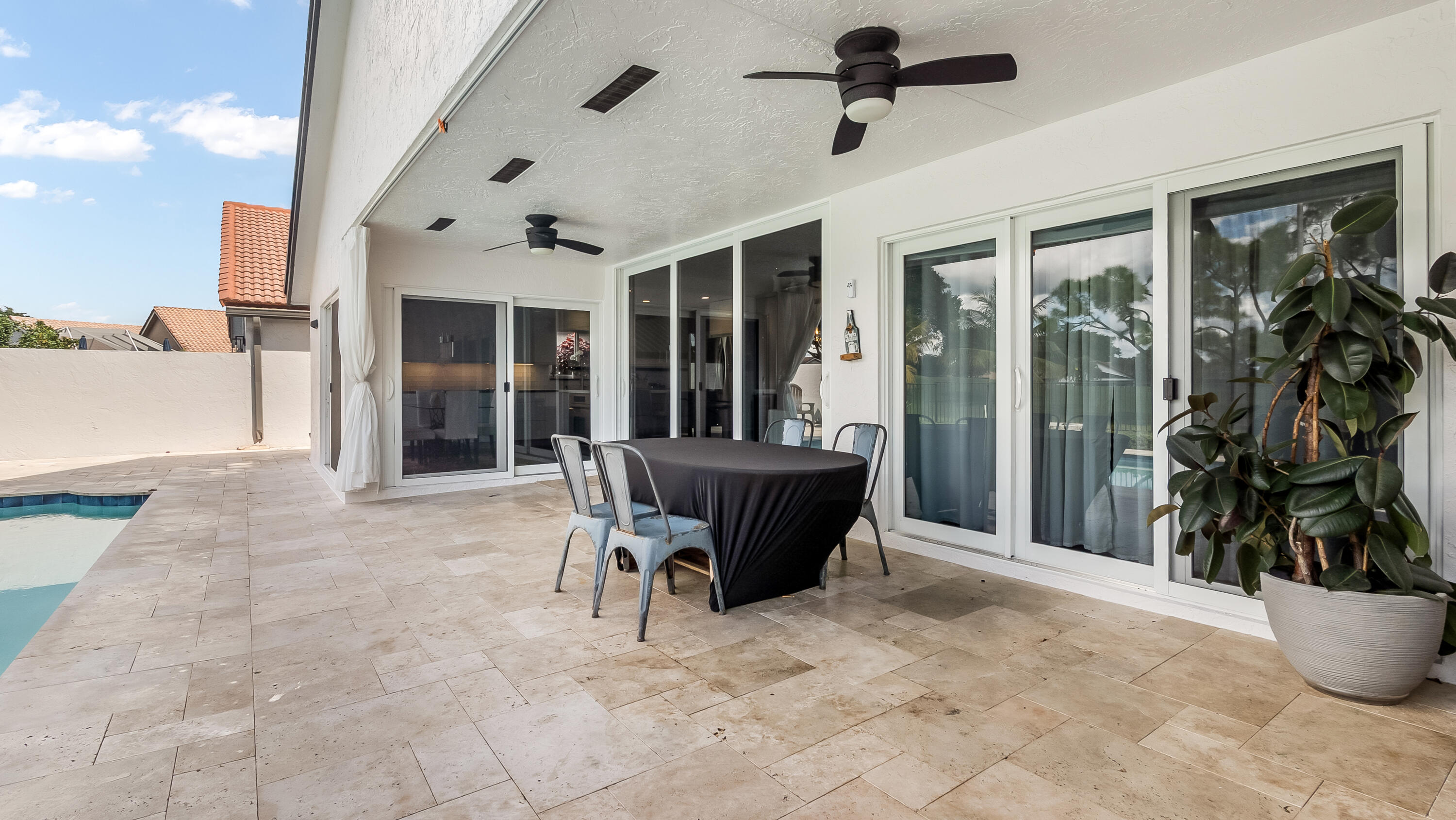 10208 Sunset Bend Drive Boca Raton, FL 33428 - Photo 39 of 40 a view of a patio with table and chairs
