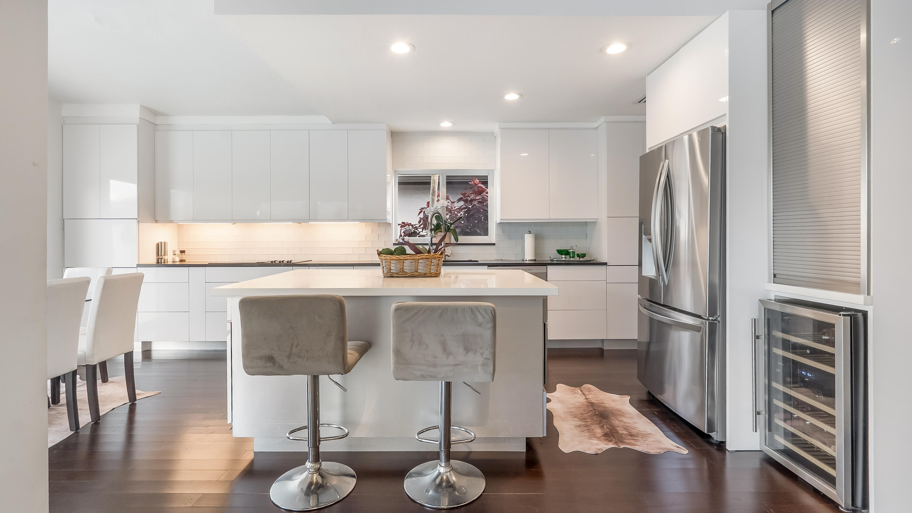 10208 Sunset Bend Drive Boca Raton, FL 33428 - Photo 4 of 40 a kitchen with kitchen island granite countertop a sink cabinets and stainless steel appliances