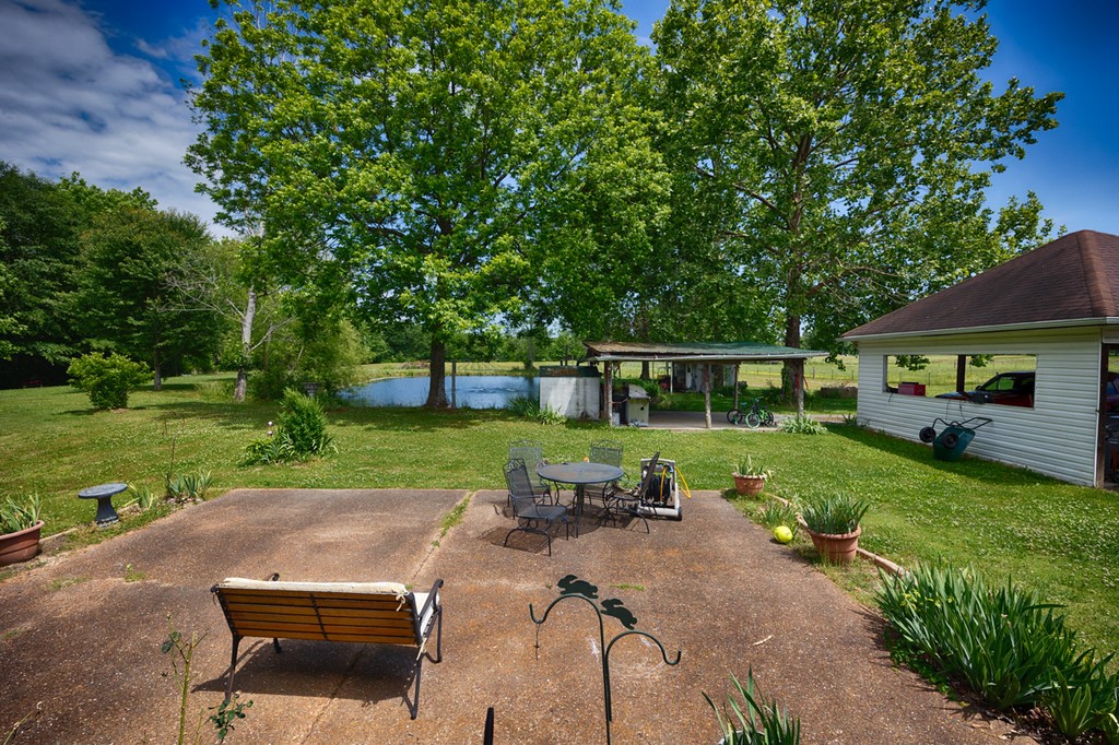 84 Scott Orchard Road Taft, TN 38488 - Photo 6 of 23 a view of a patio with a table and a chairs