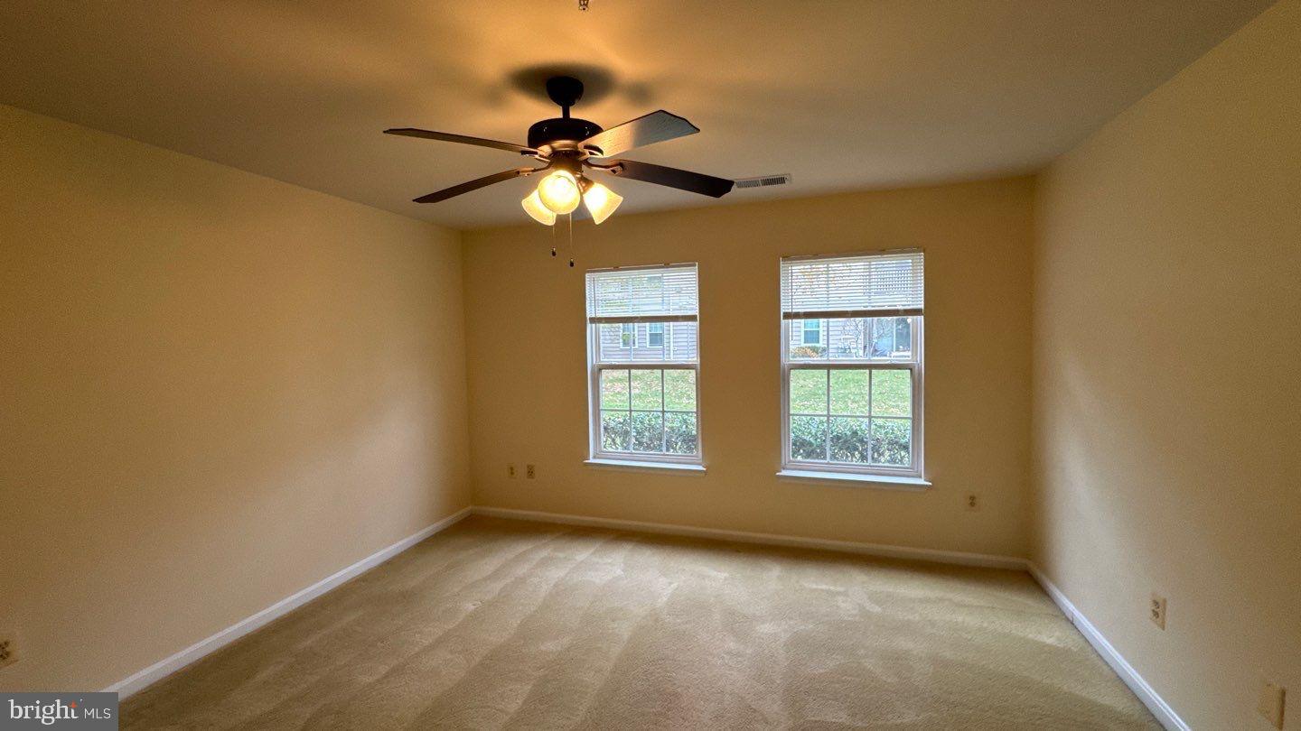 9150 Gracious End Court, Unit 103 Columbia, MD 21046 - Photo 14 of 18 a view of an empty room with a window