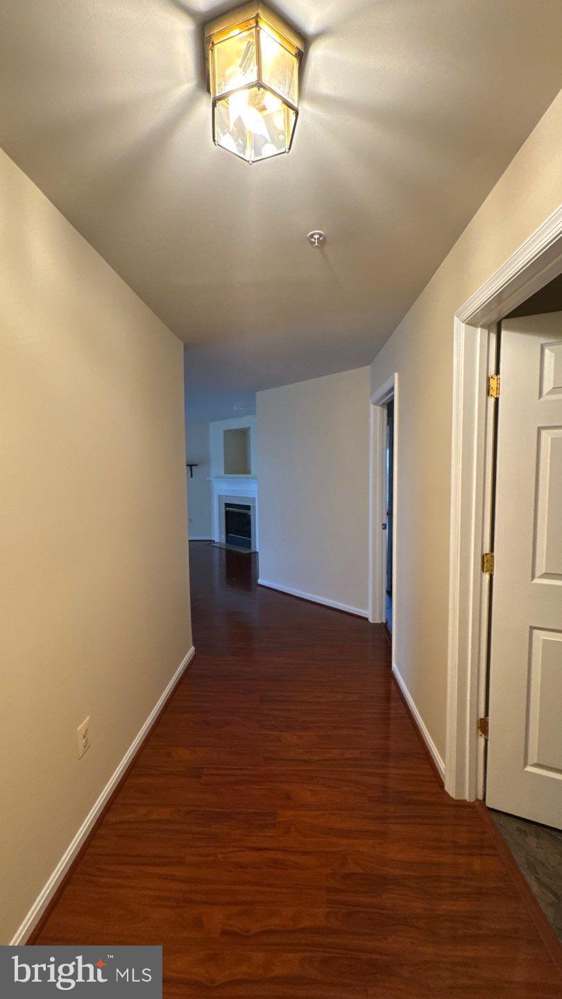 9150 Gracious End Court, Unit 103 Columbia, MD 21046 - Photo 3 of 18 a view of empty room with wooden floor
