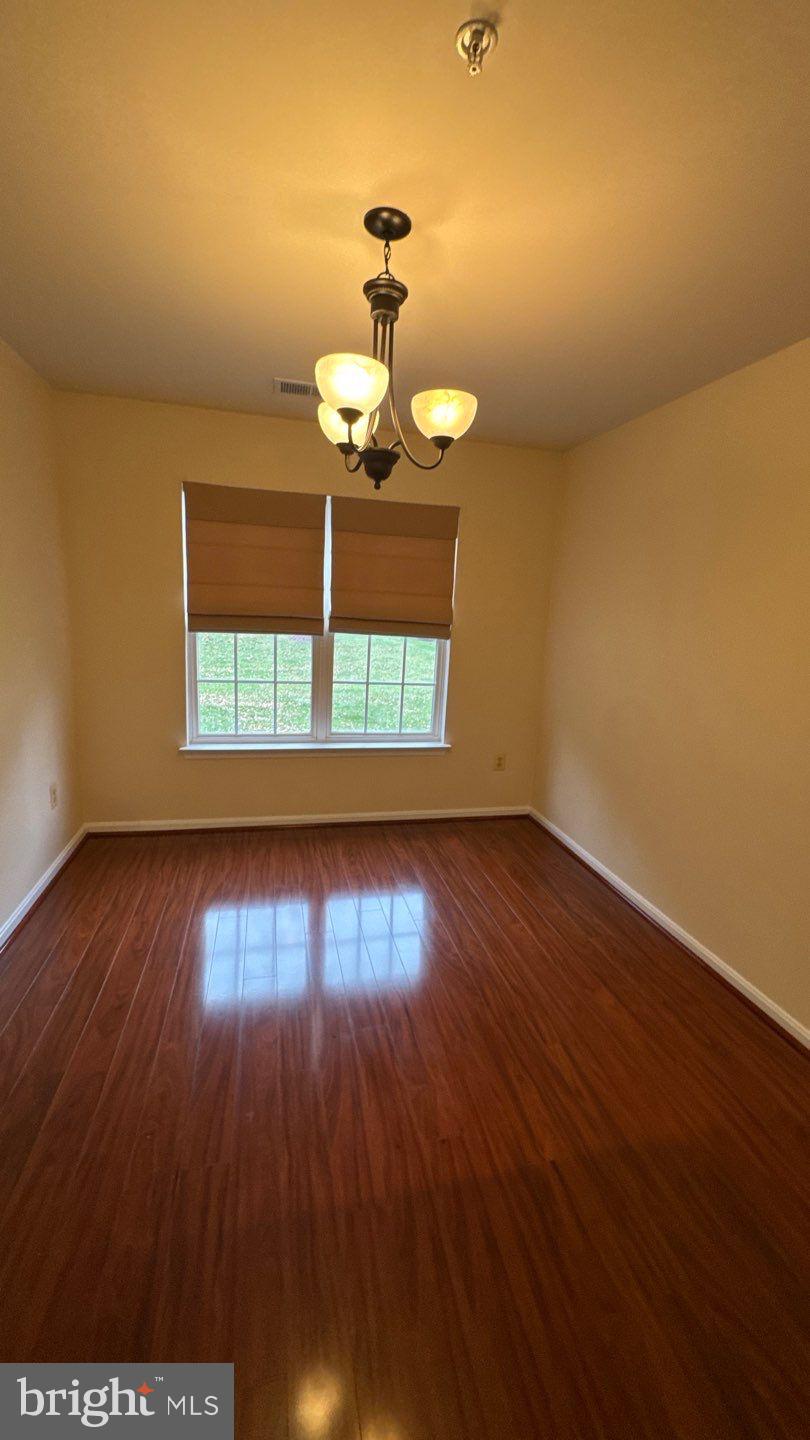 9150 Gracious End Court, Unit 103 Columbia, MD 21046 - Photo 6 of 18 a view of a room with wooden floor