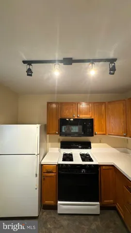a kitchen with a stove and a microwave