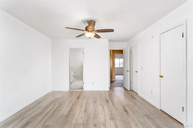 a bathroom with a tub sink toilet and mirror