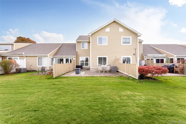a view of a green field with wooden fence