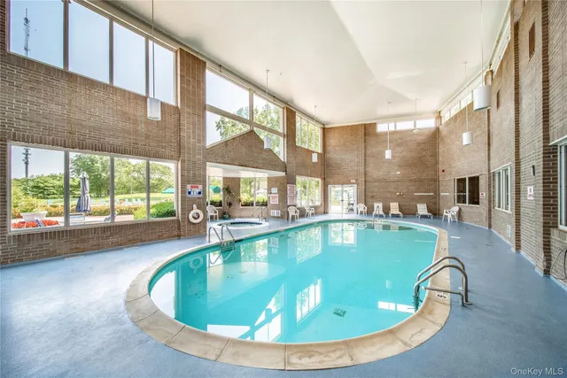 a view of swimming pool with outdoor seating