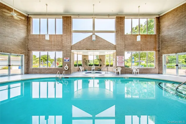 a large hall with dining table and chairs