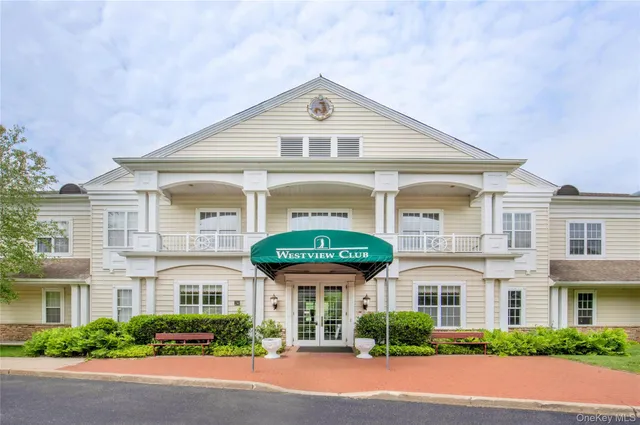 a view of a street with a building in the background