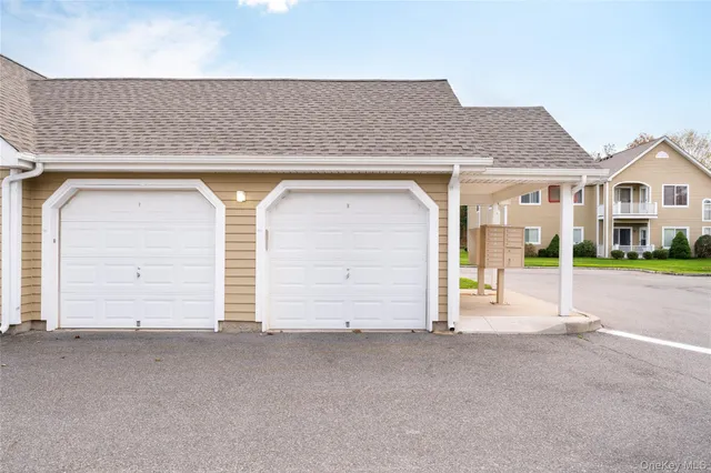 a view of a kitchen with a sink and a refrigerator