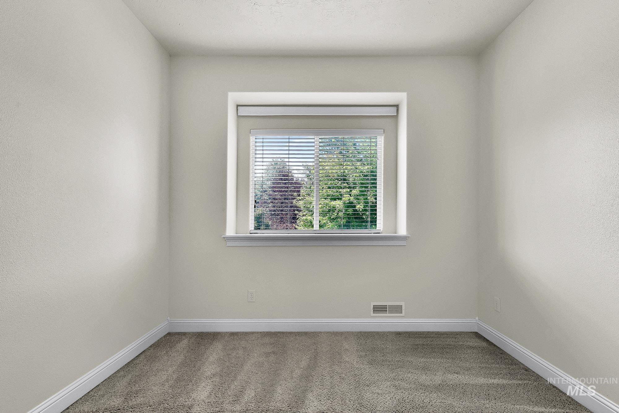 2172 West Cedar Grove Street Meridian, ID 83646 - Photo 25 of 49 Neutral-toned walls complement plush carpeting