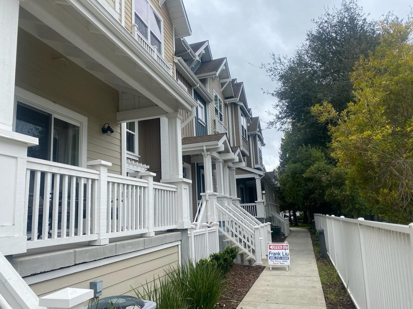 a balcony with furniture and a potted plant