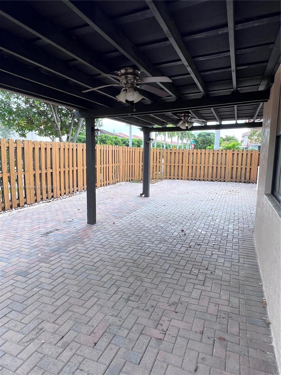 9801 Northwest 9th Street, Unit 9801 Miami, FL 33172 - Photo 7 of 7 a view of porch with a backyard
