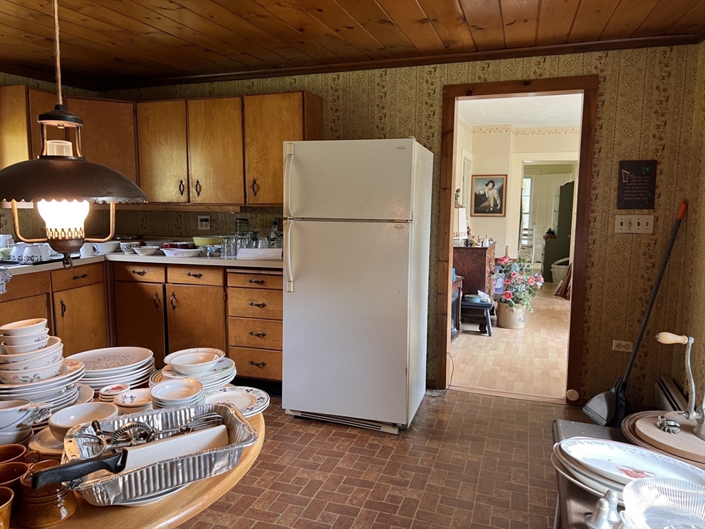 146 Potter Road Rowe, MA 01367 - Photo 11 of 40 a kitchen with a refrigerator and a stove