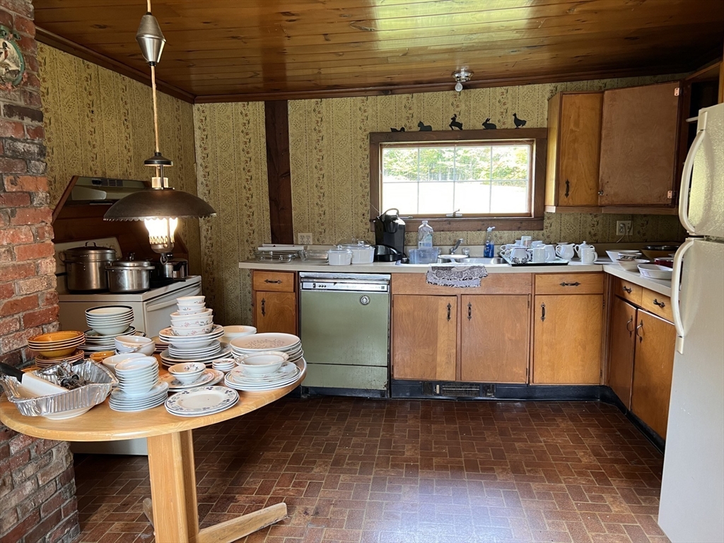 146 Potter Road Rowe, MA 01367 - Photo 12 of 40 a kitchen with a sink appliances and cabinets