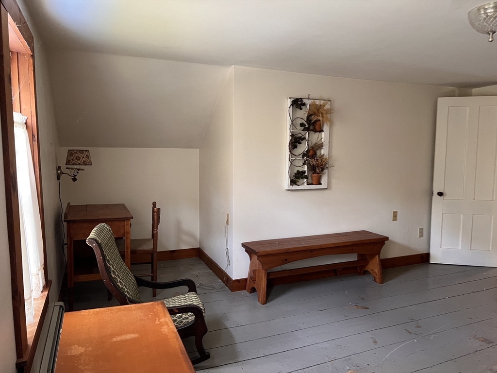 146 Potter Road Rowe, MA 01367 - Photo 20 of 40 a bedroom with bed and a window