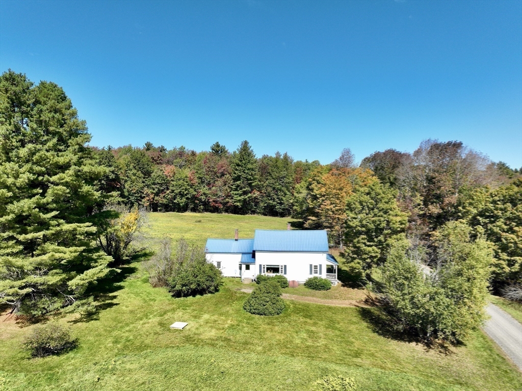 146 Potter Road Rowe, MA 01367 - Photo 2 of 40 a view of a house with a yard