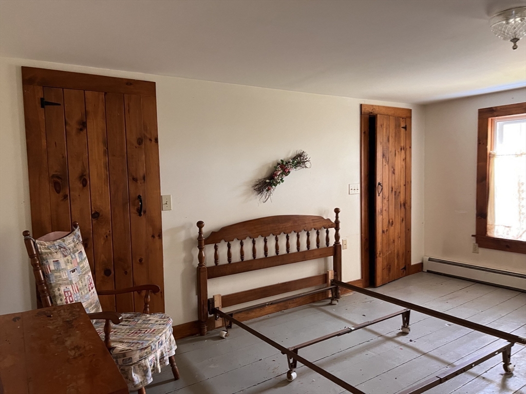 146 Potter Road Rowe, MA 01367 - Photo 21 of 40 a bedroom with furniture and window