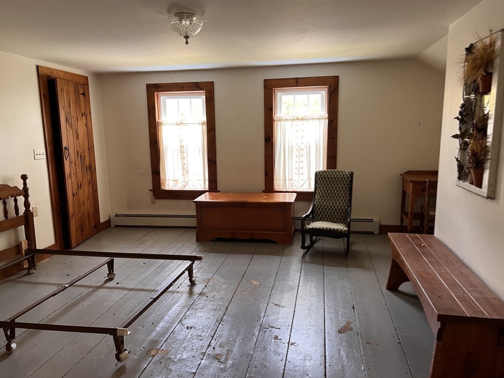 146 Potter Road Rowe, MA 01367 - Photo 22 of 40 a living room with furniture and a window