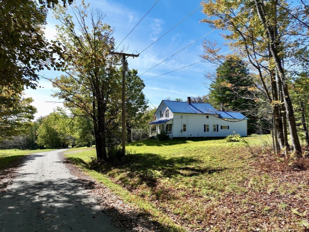 146 Potter Road Rowe, MA 01367 - Photo 31 of 40 a house that has a tree in front of it