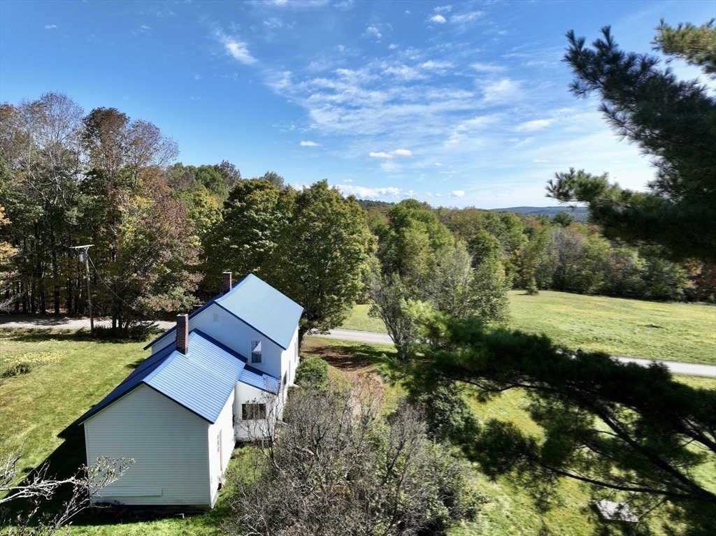 146 Potter Road Rowe, MA 01367 - Photo 36 of 40 a aerial view of a house with a yard basket ball court and outdoor seating