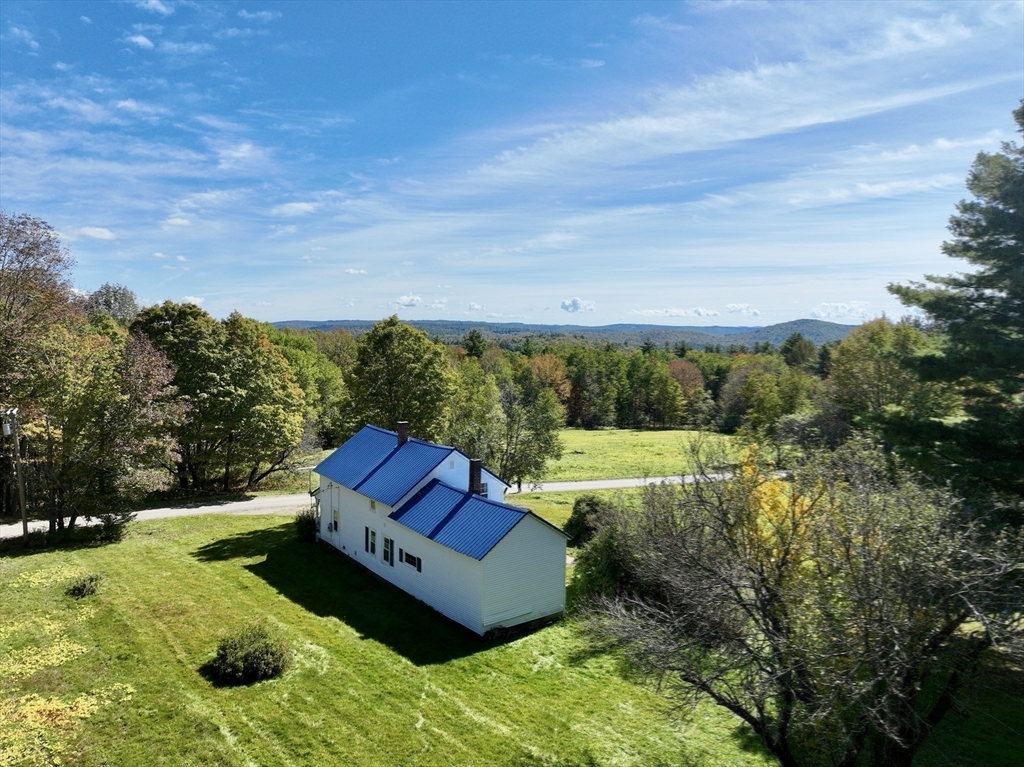 146 Potter Road Rowe, MA 01367 - Photo 37 of 40 an aerial view of a house with yard