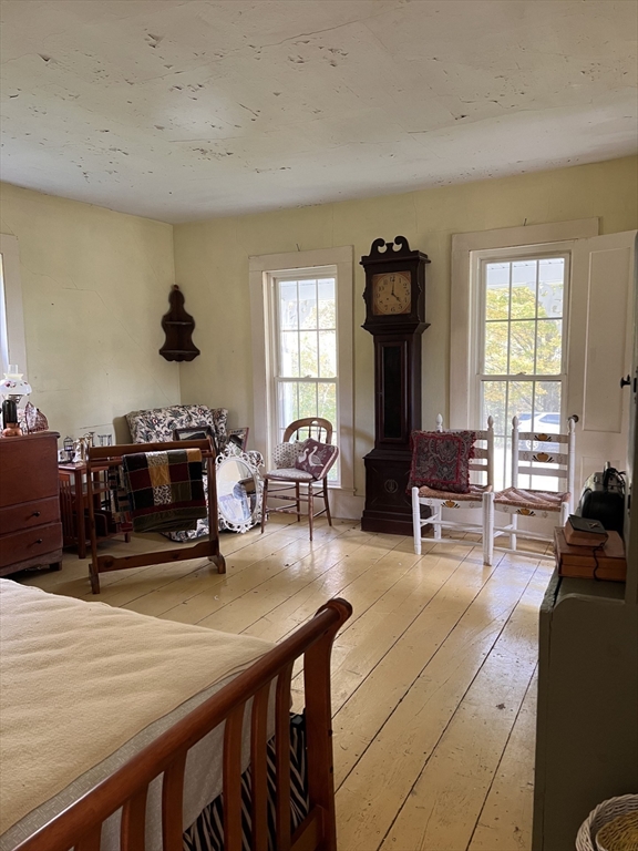 146 Potter Road Rowe, MA 01367 - Photo 9 of 40 a living room with furniture and wooden floor