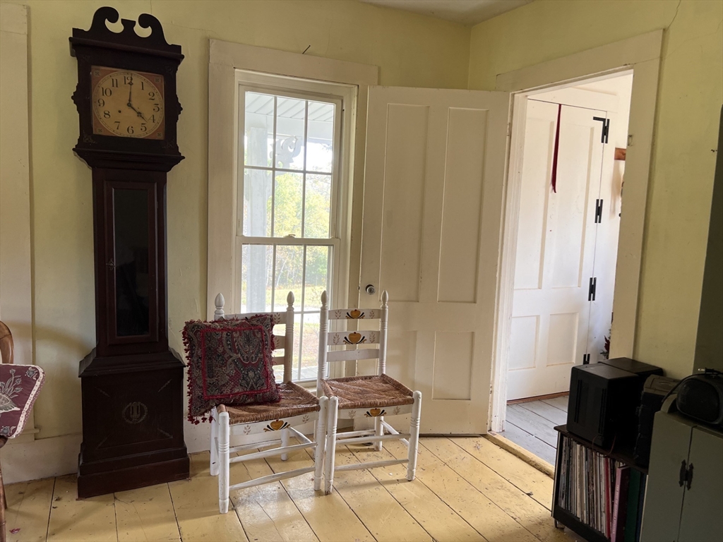 146 Potter Road Rowe, MA 01367 - Photo 10 of 40 a living room with furniture and a window