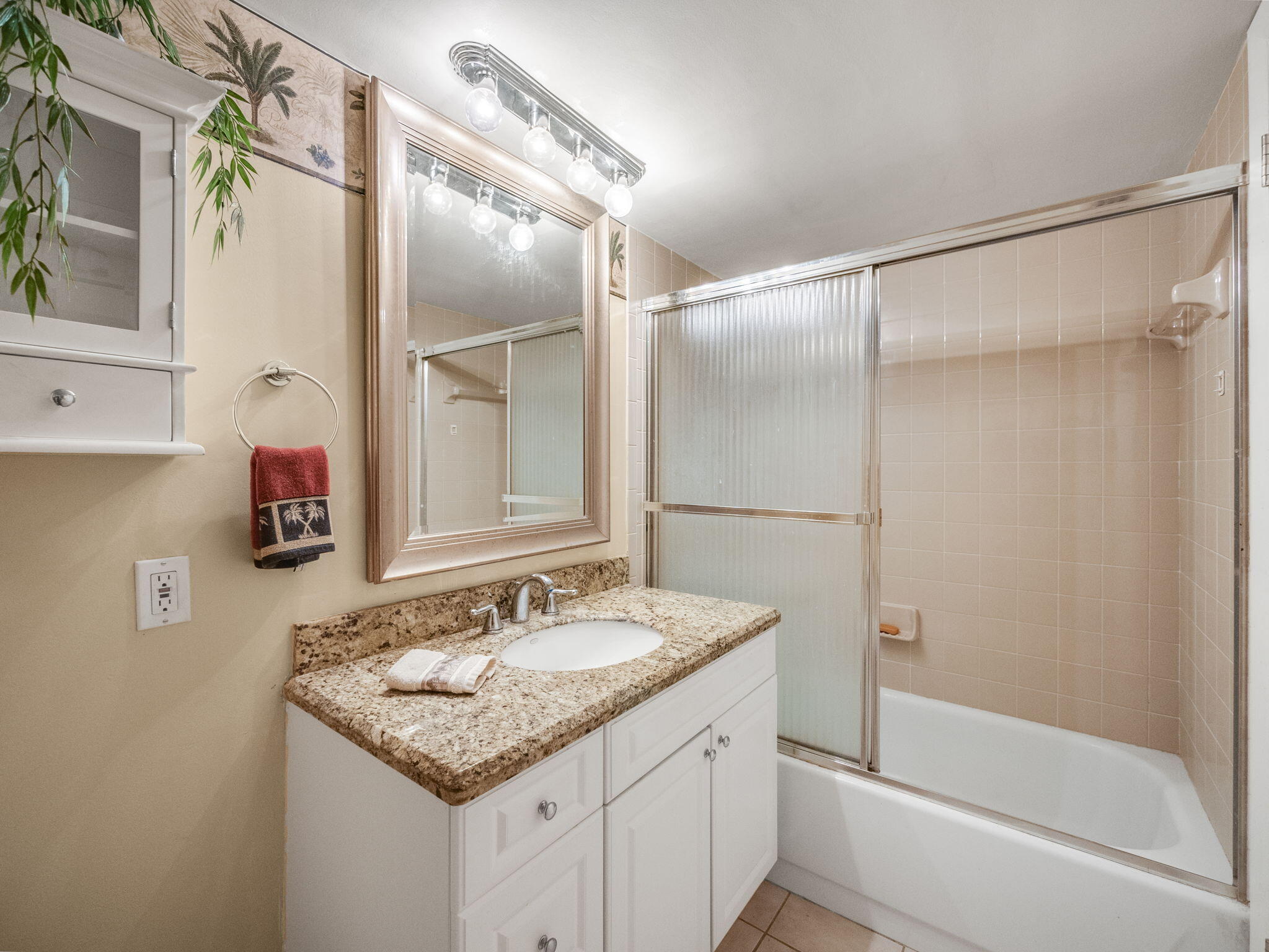 3525 South Ocean Boulevard, Unit 107 South Palm Beach, FL 33480 - Photo 17 of 21 a bathroom with a granite countertop shower sink and mirror