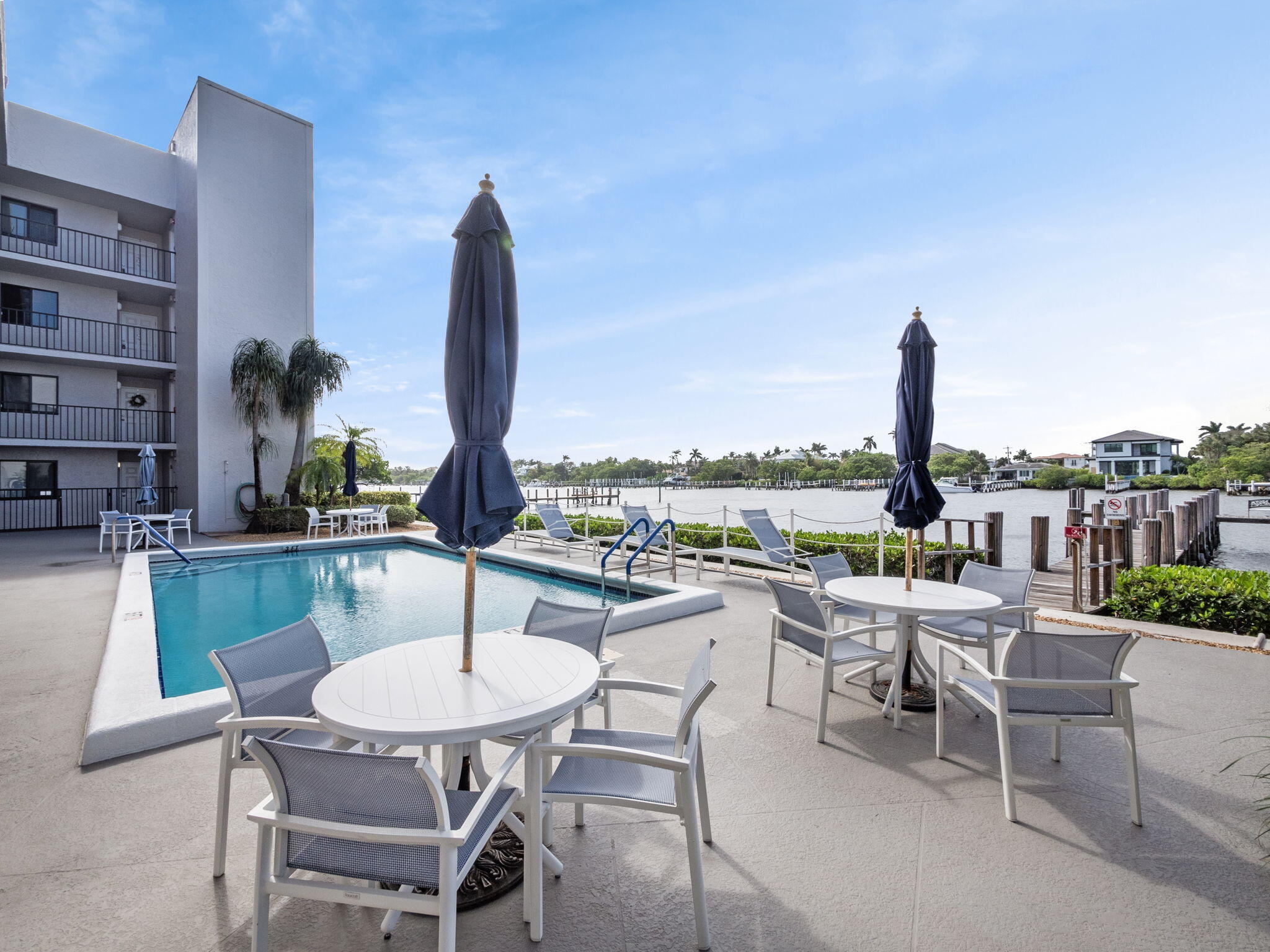 3525 South Ocean Boulevard, Unit 107 South Palm Beach, FL 33480 - Photo 21 of 21 a dining room with furniture and a floor to ceiling window